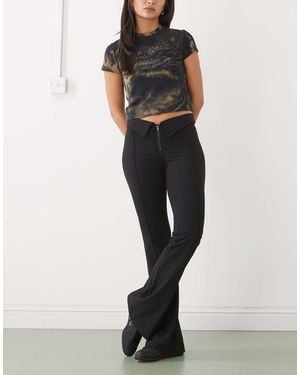 Monki Low Rise Flared Trousers With Fold Down Waist Detail - Black