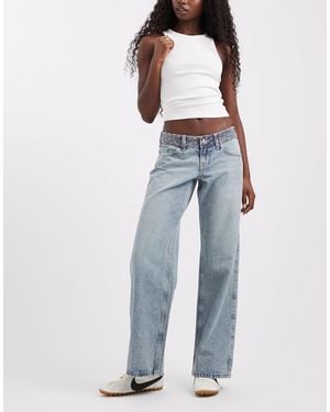Hollister Jean baggy taille ultra basse avec détail - Bleu