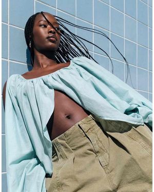 ASOS Blusa De Corte Voluminoso Y Manga Larga Con Aberturas - Azul