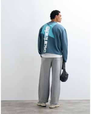 ASOS Sweat-shirt délavé avec imprimé, bords bruts et coutures apparentes en - Bleu