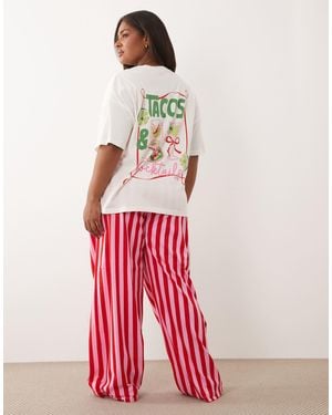 ASOS Asos design curve – pyjama aus kurzärmligem oberteil mit taco-grafik und hose - Rot