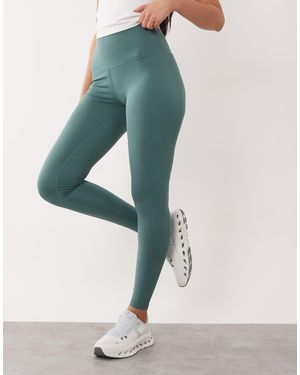 4505 Leggings Deportivos De Talle Alto Con Bolsillo Interior Y Detalle Moldeador En La Parte Trasera Icon De Hourglass - Verde