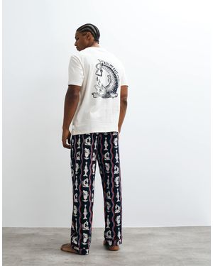 Chelsea Peers Ensemble pyjama homme t-shirt et pantalon à imprimé poisson ondulé - Blanc
