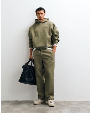 ASOS Jogger large en tissu style scuba avec broderie olive - Vert