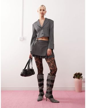 Urban Revivo Mini-jupe plissée effet superposé avec nœud - moyen - Rose