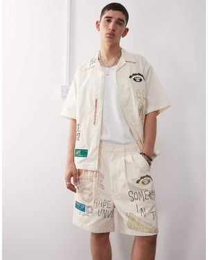 Aape By A Bathing Ape Aape By A Bathing Ape Multi Logo University Shorts - Natural