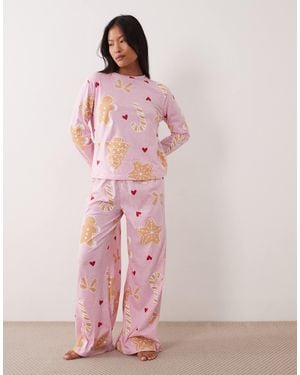 ASOS Asos design petite pyjama-set mit langärmligem oberteil und hose mit weitem bein und weihnachtskeks-motiv - Pink