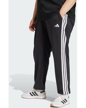 adidas Originals Essentials - pantalon en tissu éponge resserré aux chevilles à 3 bandes - et blanc - Noir