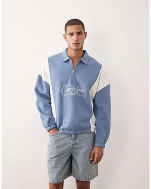ASOS Relaxed Quarter Zip With Cut & Sew Panels And Embroidered Print - Blue