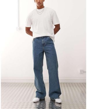 Collusion Jeans A Zampa Lavaggio Medio Con Cuciture Color Tabacco - Blu