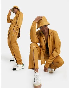 Ivy Park Adidas x – Jogginghose mit Druckknopf-Details - Braun