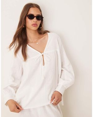 esmé studios Esmee Exclusive Relaxed Fit Tie Front Long Sleeve Beach Top - White