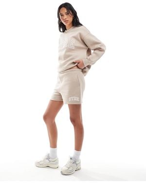The Couture Club Ctre Varsity Shorts - Natural