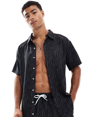OOSC Chemise manches courtes à imprimé tigré - Bleu