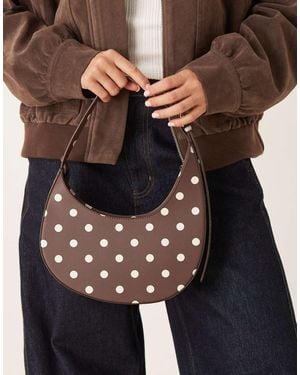 ASOS Polka Dot Asymmetric Scoop Shoulder Bag With Buckle Detail - Black
