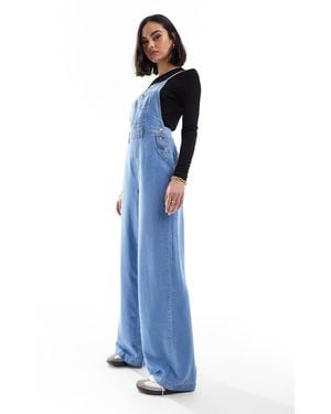 Stradivarius Denim Jumpsuit With Cross Back - Blue