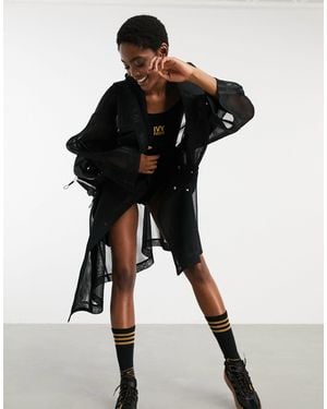 Ivy Park Adidas x – Trenchcoat aus Netzstoff mit asymmetrischem Saum - Schwarz