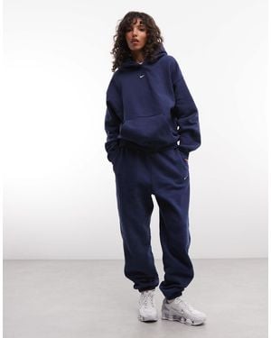 Nike Studio fleece mittelschwere oversize-jogger mit bündchen - Blau