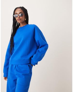 ASOS Oversized Brushback Sweatshirt With Raglan Detail - Blue