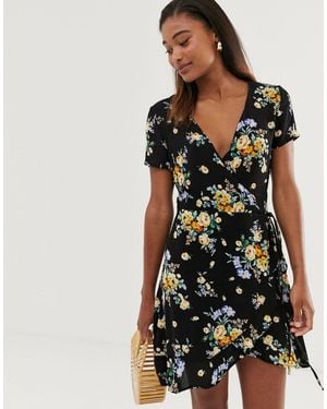 Stradivarius Vestido cruzado con estampado floral en azul y amarillo - Negro