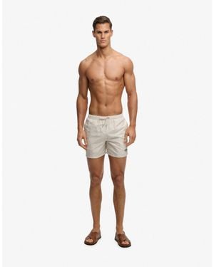 Superdry – premium – badeshorts mit kleinem geometrischem muster - Blau