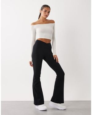 BO+TEE Cross Over Waistband Flare Leggings - White