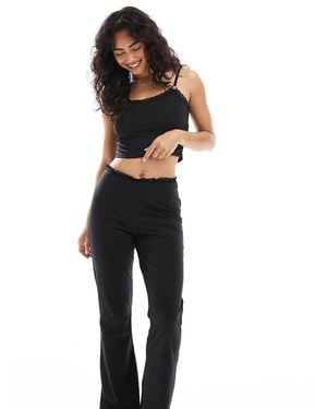 The Frolic Pantalones De Pijama Negros De Punto Liso De Corte Slim Acampanado Con Ribete De Encaje Exclusivos De (Parte De Un Conjunto)