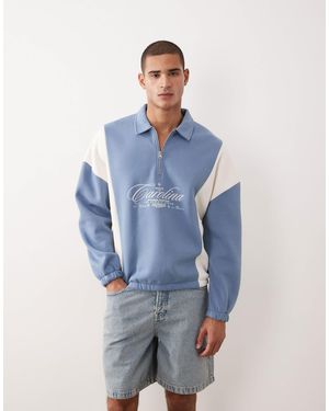 ASOS Relaxed Quarter Zip With Cut & Sew Panels And Embroidered Print - Blue