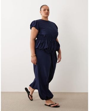 ASOS Asos Design Curve Jumpsuit With Peplum And Balloon Legs - Blue