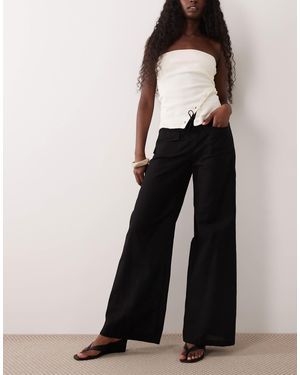 Motel Yua - pantalon à taille basse - Noir