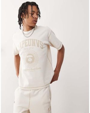 Aape By A Bathing Ape Camiseta Blanco Hueso Con Diseño Reversible Y Logo Universitario De Aape By A Bathing Ape