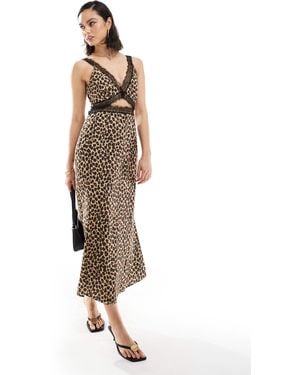 Never Fully Dressed – mimi – midaxi-kleid aus spitze mit cut-outs und leopardenmuster - Weiß