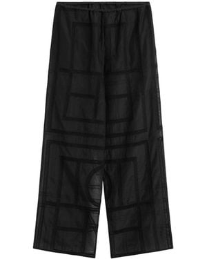 TOTEME Pantalones de crochet de monograma de en negro