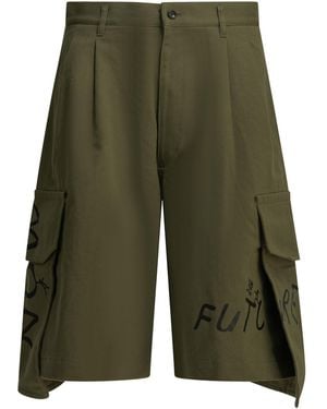 Comme des Garçons Shorts cargo tipo camisa con estampado de Comme Des Garçons - Verde