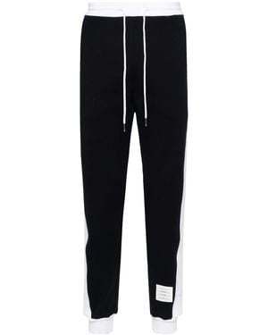 Thom Browne Pantalon de survêtement avec 4 barres techniques en jersey bouclé classique uni - Noir