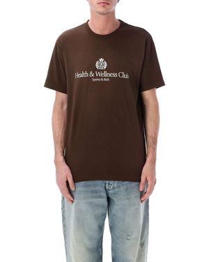 Sporty & Rich Sportliche und reichhaltige T-Shirts und Polos in Braun