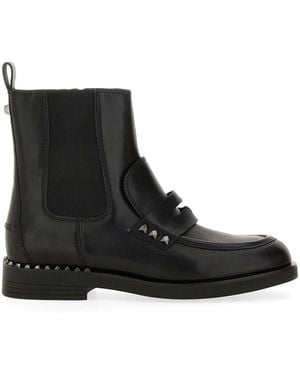 Ash Boot Wings Studs in Black Lyst