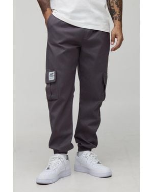 BoohooMAN Slim Fit Elasticated Waist Cuffed Cargo Pants With Tab - Blue