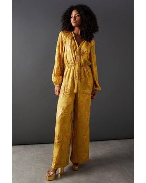 Warehouse Sun Metallic Jacquard Tie Neck Jumpsuit - Gray