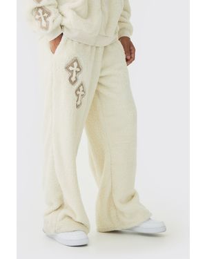 BoohooMAN Wide Leg Embroidered Gothic Cross Teddy Borg Joggers - Natural