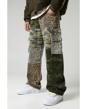 BoohooMAN Baggy Fit Camo Leopard Patchwork Pants - Green