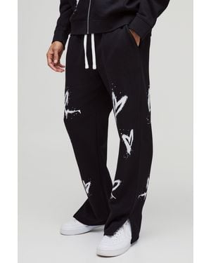 BoohooMAN Lockere Jogginghose mit geteiltem Saum - Schwarz