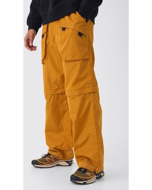 BoohooMAN Elasticated Waist Baggy Nylon Zip Off Convertible Trousers - Orange