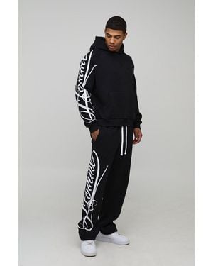 BoohooMAN Oversized Boxy Homme Script Hoodie And Relaxed Split Hem Jogger Tracksuit - Black