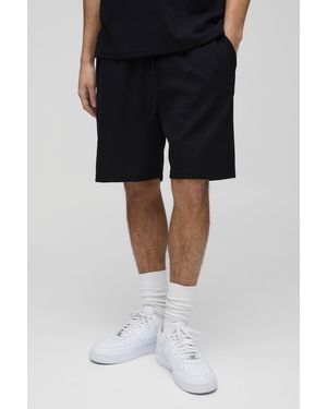 BoohooMAN Relaxed Embroidered Waffle Shorts - Black