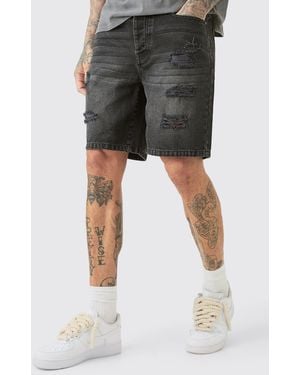 BoohooMAN Tall Slim Fit Distressed Denim Shorts In Washed Black