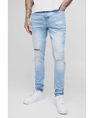 BoohooMAN Tall Skinny All Over Ripped Bleached Paint Splatter Jeans - Blue