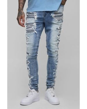 BoohooMAN Tall Stacked Skinny Extreme Rip & Repair Skinny Jeans - Blue