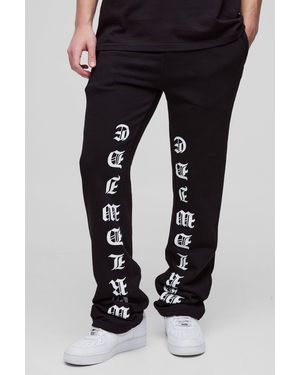 BoohooMAN Slim-Fit Schlag-Jogginghose mit Print - Schwarz