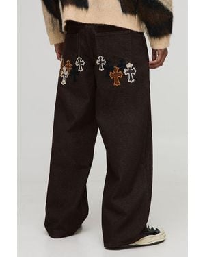 BoohooMAN Baggy Fit Cow Cross Applique Jeans - Black